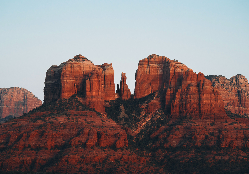 A close up on the sandstone saddle points, or gaps of Cathedral Rock, one of the most famous natural landmarks surrounding the desert town of Sedona, Arizona, in the Coconino National Forest, USA.