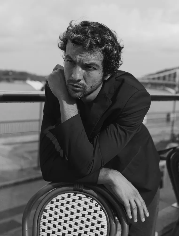 Black and white portrait of a young man in a suit