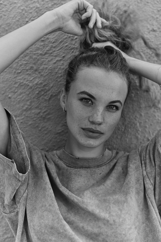 Close-up black and white portrait of a beautiful young woman