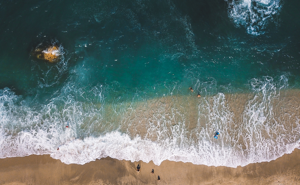 Aerial View From Flying Drone Of People Relaxing