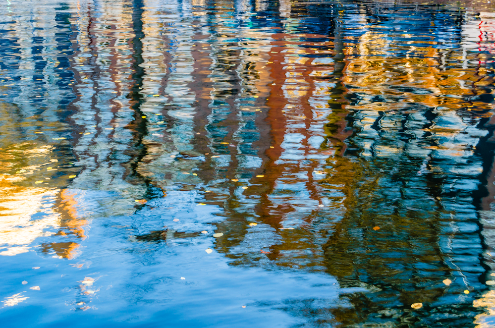 Colorful reflection of the buildings along the canal in Amsterda