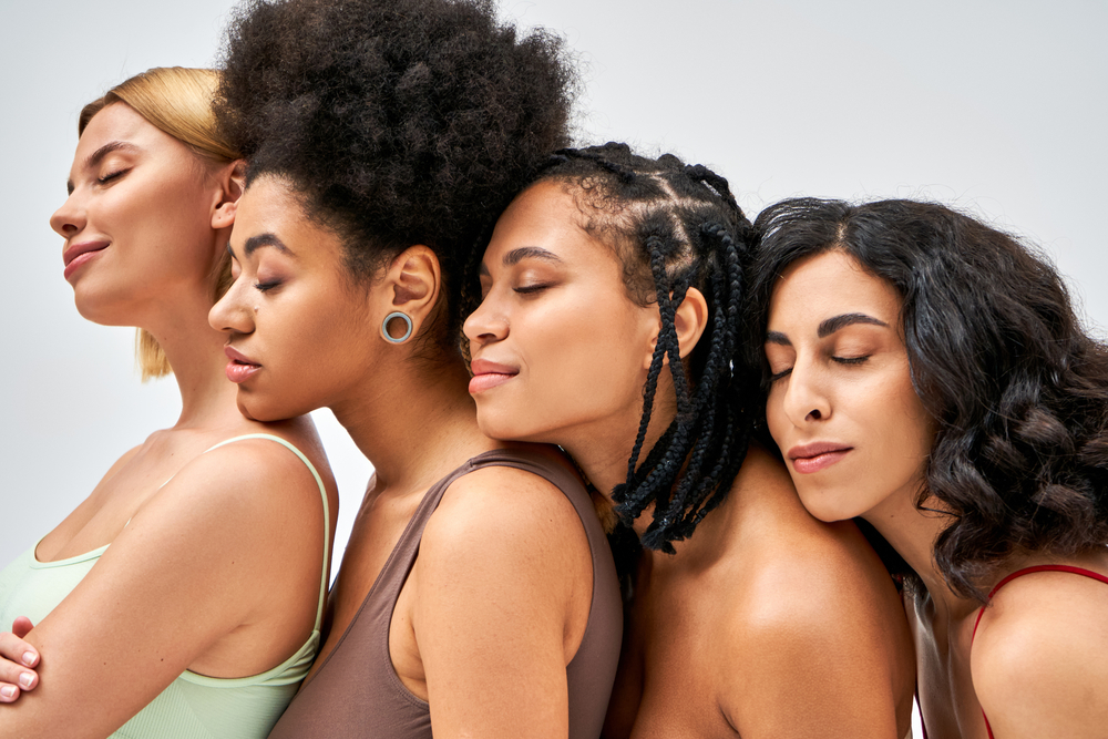 diversity image with four girls supporting each other