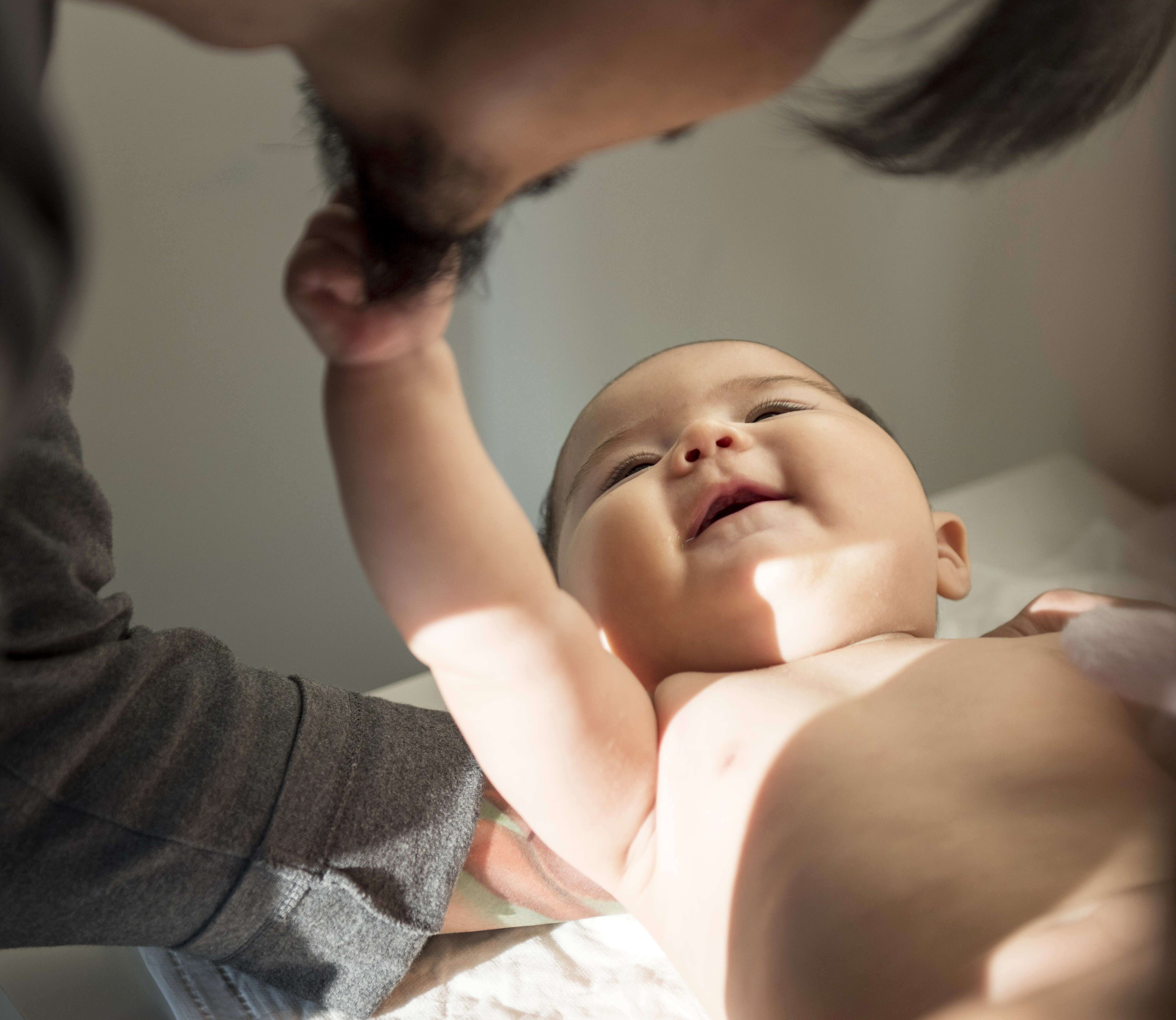 Photo Asian man is taking care of his child.