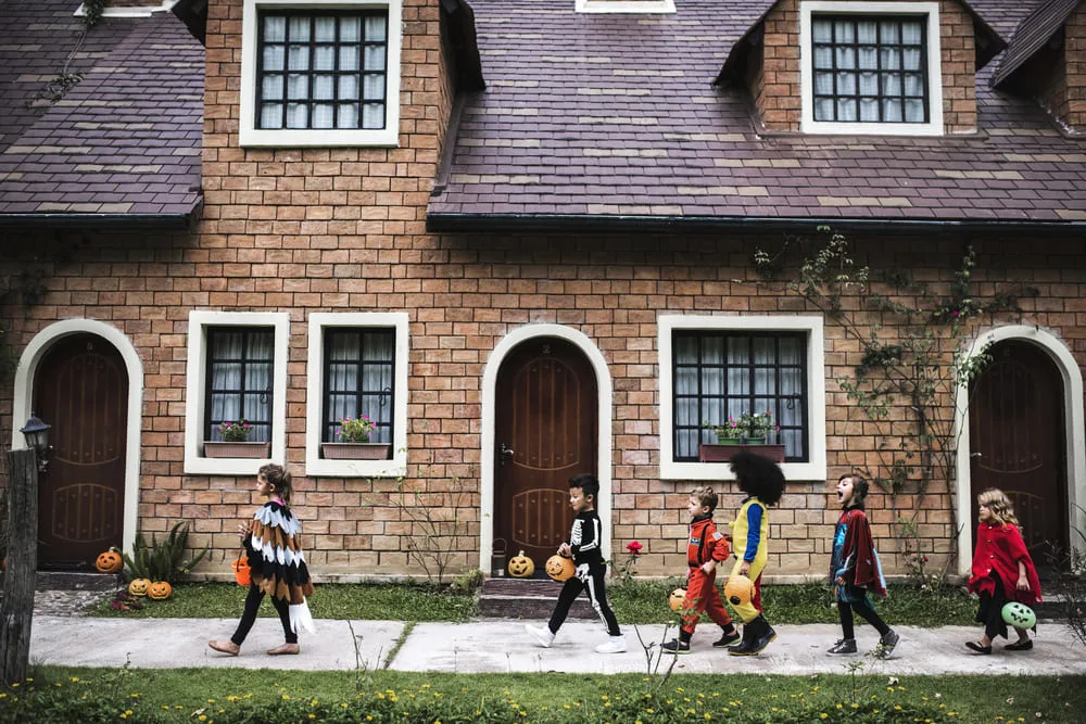 Photo kids trick or treating during Halloween